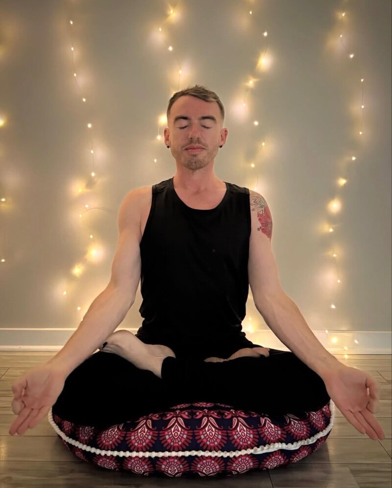E. Benjamin Randall practicing yoga